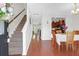 Inviting entryway with carpeted stairs leads into a home featuring hardwood floors and an open-concept layout at 315 Flyway Rd, Goose Creek, SC 29445