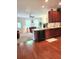 Open-concept kitchen featuring dark wood cabinets, granite countertops, and stainless steel appliances at 315 Flyway Rd, Goose Creek, SC 29445