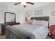 Serene main bedroom boasts a decorative ceiling fan, a large dresser, and soft, natural lighting at 315 Flyway Rd, Goose Creek, SC 29445