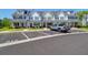 Exterior view of townhomes with well-maintained landscaping, clearly marked parking spots, and a welcoming atmosphere at 315 Flyway Rd, Goose Creek, SC 29445