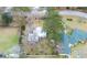 Overhead shot of the charming home with mature trees and a white picket fence at 3589 Walter Dr, Johns Island, SC 29455