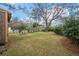 Spacious backyard with an established lawn, mature trees and a defined lawn at 3589 Walter Dr, Johns Island, SC 29455