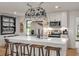 Bright kitchen features an oversized island with pendant lighting and stainless steel appliances at 3589 Walter Dr, Johns Island, SC 29455