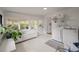 Bright laundry room with ample natural light, storage, and a modern washer and dryer at 3589 Walter Dr, Johns Island, SC 29455