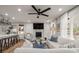 Spacious living room with a modern fireplace and open layout, perfect for gatherings and relaxation at 3589 Walter Dr, Johns Island, SC 29455