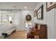 Stylish living room featuring a piano and abundant natural light, creating a warm and inviting atmosphere at 3589 Walter Dr, Johns Island, SC 29455