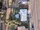 Overhead view of the property, showcasing its metal roof, fenced backyard, and proximity to the beach at 407 Palmetto Blvd, Edisto Beach, SC 29438