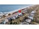 Stunning aerial view of oceanfront home with private beach access, perfect for coastal living at 407 Palmetto Blvd, Edisto Beach, SC 29438