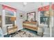 Well-lit bedroom with stylish, modern wood furniture and a large window at 407 Palmetto Blvd, Edisto Beach, SC 29438