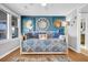 Cozy bedroom with daybed, beach-themed decor, and natural light at 407 Palmetto Blvd, Edisto Beach, SC 29438