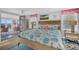 Bright bedroom with ocean view, beach-themed decor, and access to porch at 407 Palmetto Blvd, Edisto Beach, SC 29438