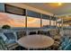 Relaxing screened deck area perfect for enjoying ocean breezes and breathtaking sunsets at 407 Palmetto Blvd, Edisto Beach, SC 29438