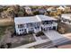 Inviting home exterior with a white metal roof, screened porches, and manicured landscaping at 407 Palmetto Blvd, Edisto Beach, SC 29438