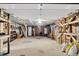 Spacious garage interior with ample storage shelving, a door, and a window for natural light at 407 Palmetto Blvd, Edisto Beach, SC 29438