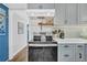 Bright kitchen featuring stainless steel stove, grey cabinets, and white countertops at 407 Palmetto Blvd, Edisto Beach, SC 29438