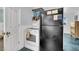 Functional kitchen with white appliances, a white range and ample storage space at 407 Palmetto Blvd, Edisto Beach, SC 29438