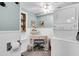Convenient laundry area with white appliances, a small desk, and beach-themed decor at 407 Palmetto Blvd, Edisto Beach, SC 29438