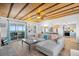 Inviting living room with a fireplace, hardwood floors, comfortable seating, and sliding door to balcony with ocean view at 407 Palmetto Blvd, Edisto Beach, SC 29438