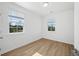 Comfortable bedroom featuring wood-look flooring and two windows at 4432 Oakwood Ave, North Charleston, SC 29405