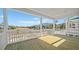 A rear deck overlooks a field and trees at 4432 Oakwood Ave, North Charleston, SC 29405