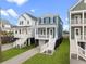 A row of newly constructed homes stand side-by-side at 4432 Oakwood Ave, North Charleston, SC 29405