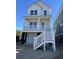 New construction, two-story home featuring a welcoming porch and a ground-level garage at 4432 Oakwood Ave, North Charleston, SC 29405