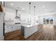 Modern kitchen boasts a large island, stainless steel appliances, and lots of natural light at 4432 Oakwood Ave, North Charleston, SC 29405