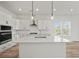 Bright, modern kitchen featuring a center island with bar seating and pendant lighting at 4432 Oakwood Ave, North Charleston, SC 29405