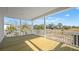 Spacious covered porch with wood flooring and scenic views of the surrounding landscape at 4432 Oakwood Ave, North Charleston, SC 29405