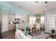 Well-lit kitchen and dining nook with stainless appliances, seating, and a neutral decor scheme at 478 Rowley Ln, Summerville, SC 29486