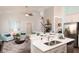 Open-concept living room with modern finishes and a kitchen bar area, perfect for entertaining guests at 478 Rowley Ln, Summerville, SC 29486