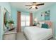 This is a bedroom with lovely cool-toned walls, warm accents and a ceiling fan at 478 Rowley Ln, Summerville, SC 29486