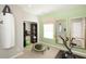 Bright exercise room featuring a workout machine, punching bag, mirrors, and shelving at 478 Rowley Ln, Summerville, SC 29486