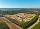 Aerial view of the property shows it is near new home construction and is a mostly wooded lot at 516 & 508 Robnshers Pl, Ridgeville, SC 29472