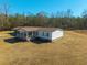 Scenic aerial view of the home highlighting the expansive property and peaceful, wooded surroundings at 516 & 508 Robnshers Pl, Ridgeville, SC 29472