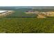 A beautiful aerial view of a land parcel filled with trees and showing the edge of a neighborhood at 516 & 508 Robnshers Pl, Ridgeville, SC 29472