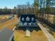 A charming property featuring mature trees and a long driveway leading to a lovely home under a bright, sunny sky at 516 & 508 Robnshers Pl, Ridgeville, SC 29472