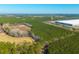 Large distribution warehouse bordering acreage, showing trees and potential for development at 516 & 508 Robnshers Pl, Ridgeville, SC 29472