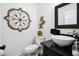 Modern half-bathroom with vessel sink, black granite countertop, decorative mirror, and contemporary fixtures at 516 & 508 Robnshers Pl, Ridgeville, SC 29472