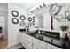 Modern bathroom featuring a black countertop with a vessel sink, and decorative mirrors at 516 & 508 Robnshers Pl, Ridgeville, SC 29472