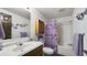 This bathroom has a vanity with a sink, toilet, tub, and shower combo with a floral curtain at 516 & 508 Robnshers Pl, Ridgeville, SC 29472