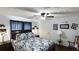 This bedroom has white walls, a ceiling fan, an end table, and a wooden bed frame at 516 & 508 Robnshers Pl, Ridgeville, SC 29472