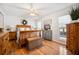 Inviting bedroom with hardwood floors, a ceiling fan, and ample natural light at 516 & 508 Robnshers Pl, Ridgeville, SC 29472