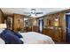 This cozy bedroom has natural wood paneling, ceiling fan, and a sliding door mirrored closet at 516 & 508 Robnshers Pl, Ridgeville, SC 29472