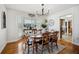 Charming dining room showcases hardwood floors, a bay window, and modern light fixture for elegant meals at 516 & 508 Robnshers Pl, Ridgeville, SC 29472