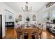 Bright dining room with hardwood floors and decorative windows, perfect for Gathering meals and entertaining guests at 516 & 508 Robnshers Pl, Ridgeville, SC 29472