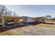 Spacious property featuring a carport, large driveway, and inviting front porch, perfect for parking and outdoor living at 516 & 508 Robnshers Pl, Ridgeville, SC 29472