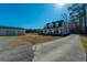 Beautiful two-story home with a wraparound porch and a detached two-car garage with a long drive way at 516 & 508 Robnshers Pl, Ridgeville, SC 29472