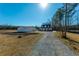 Picturesque property with a home and a detached two-car garage surrounded by a spacious yard and mature trees at 516 & 508 Robnshers Pl, Ridgeville, SC 29472