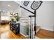 Bright foyer features hardwood floors, a staircase with wooden treads, and stylish decorative accents at 516 & 508 Robnshers Pl, Ridgeville, SC 29472